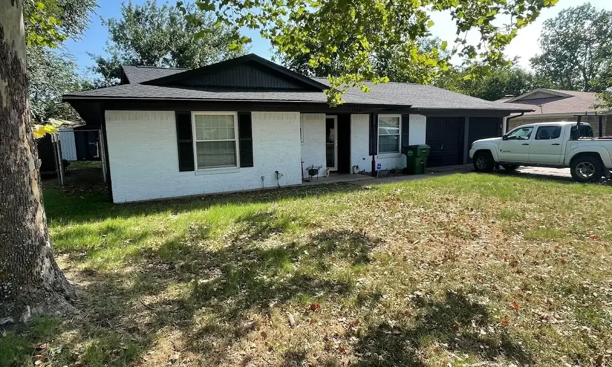 Professional roofing crew working on a residential roof in Miami